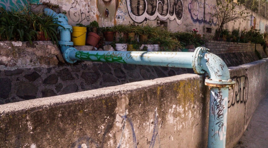 This single pipe feeds water from a reservoir above down to thousands of residents via gravity.